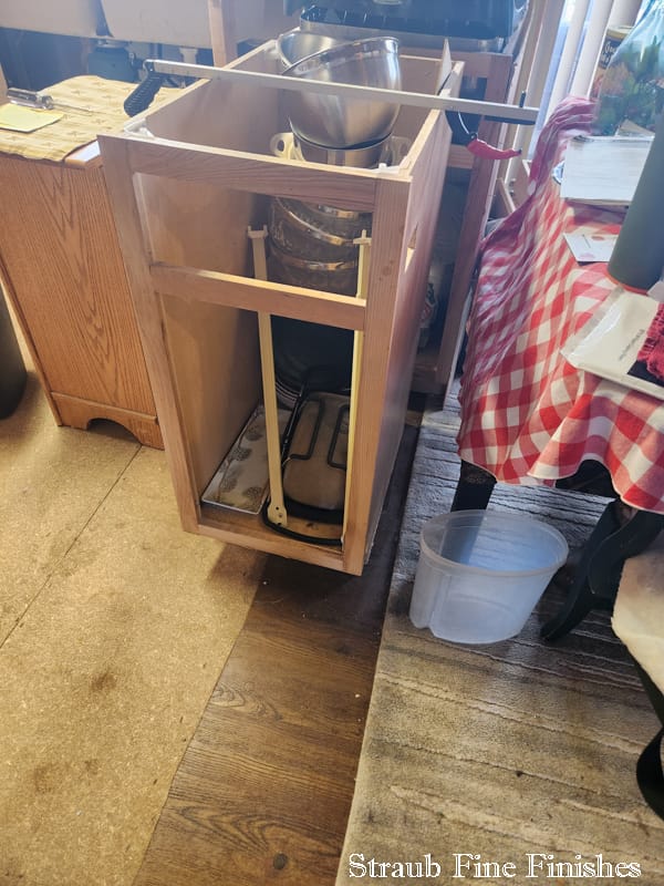 Photo showing dismantling of base cabinets. This one was able to be repaired, but several were completely destroyed by the remediation contractor. We worked with the adjuster here again to provide the needed evidence for replacement of the cabinets that couldn't be repaired or were thrown away during remediation.