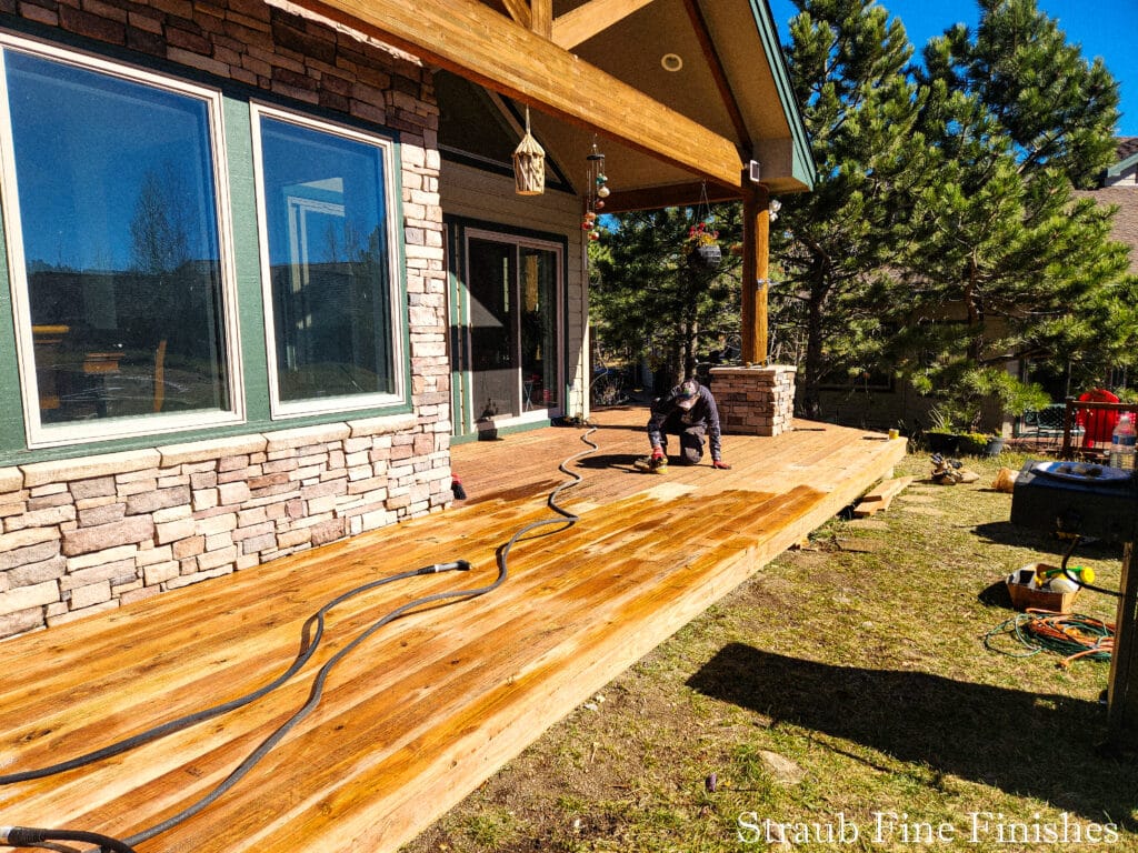 Finishing up the sanding and waiting for the washed deck surface to dry. 