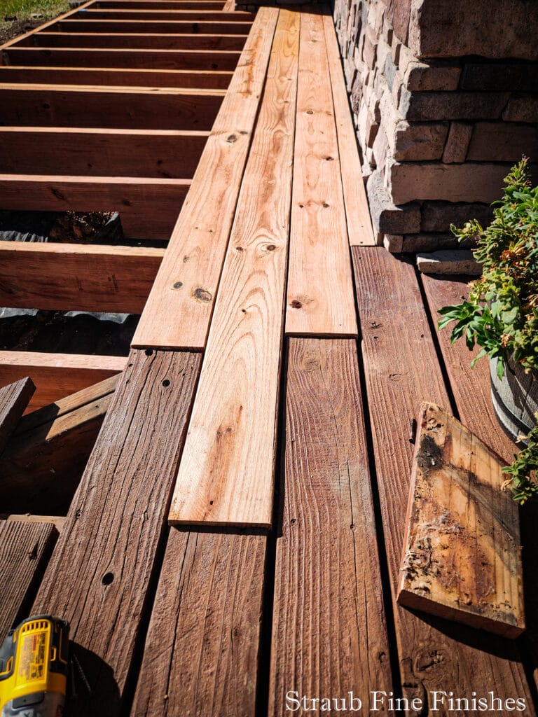 Adding Deck Boards - staggered to merge between the old and new. 