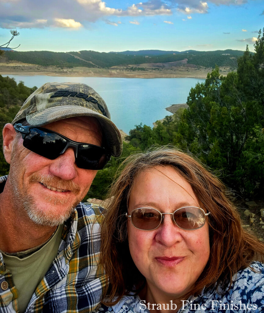 20250415_185445 Chris and Faye Straub, the husband-and-wife team behind Straub Fine Finishes, at a Colorado reservoir at dusk