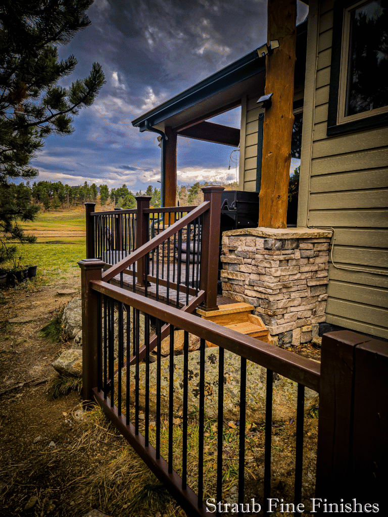 Custom composite deck black railings stone column