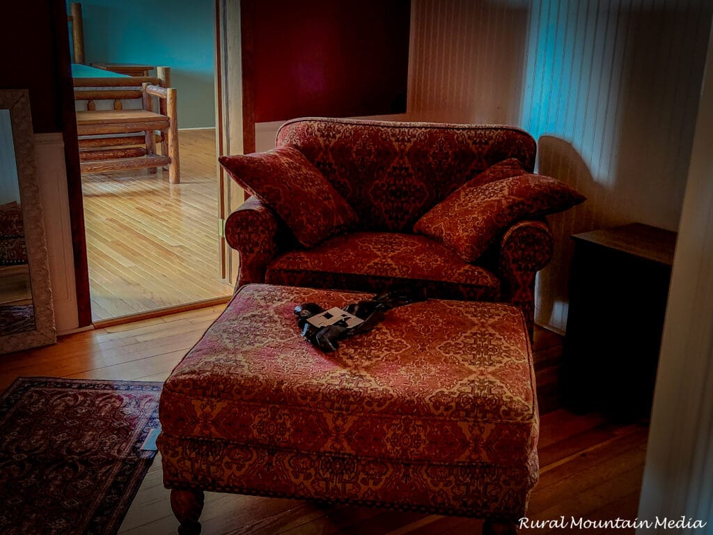 Antique red damask armchair cabin corner