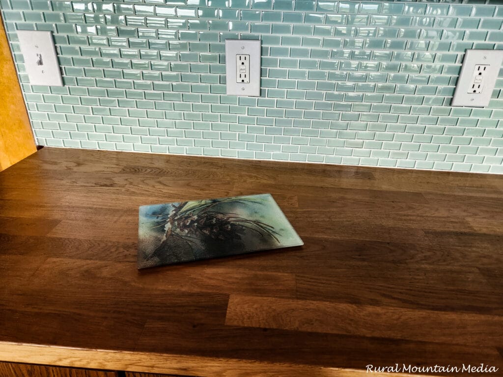 Aqua glass subway tile backsplash butcher block