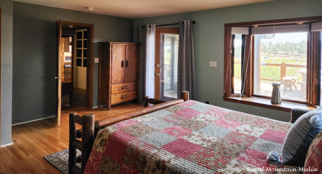 Cabin bedroom log bed patchwork quilt
